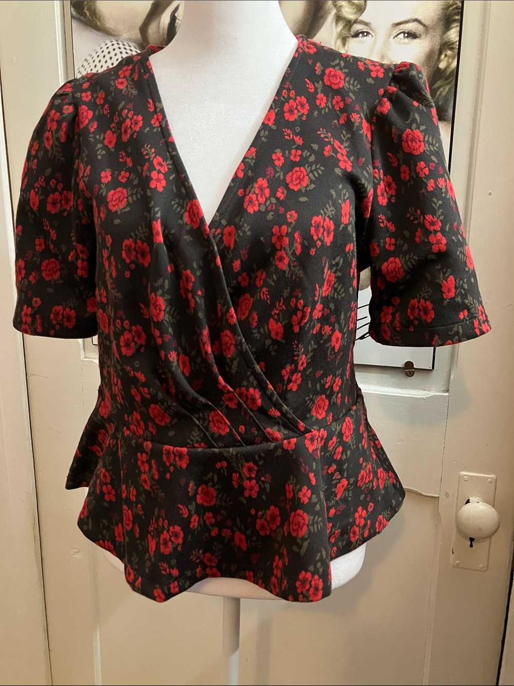Anthropologie Black Wrap Peplum Top with Red Floral Print